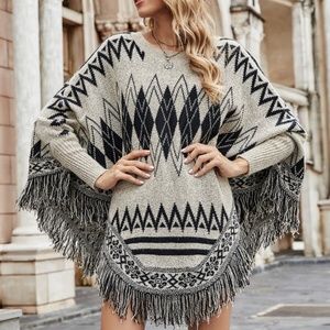 Cream Tribal print tassel hem poncho sweater